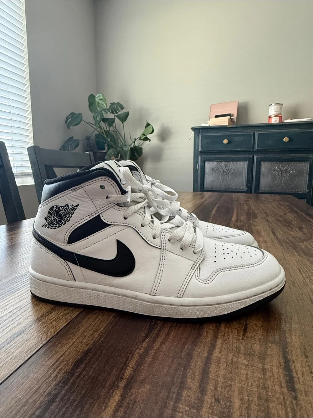 Nike Air Jordan 1 White and Black Mid-Top Sneakers